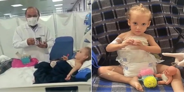 Heloá, siamesa separada em Goiânia, brinca e presenteia médico em hospital; Veja o vídeo